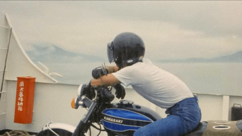 HIS MOTORBIKE, HER ISLAND